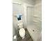 Bright bathroom featuring a toilet and a white stand-up shower at 590 Portside Dr, North Port, FL 34287