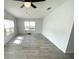 Bedroom featuring ceiling fan, neutral wall paint, and windows providing plenty of natural light at 590 Portside Dr, North Port, FL 34287