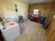 Utility room with washer, dryer, water heater, workbench and storage at 590 Portside Dr, North Port, FL 34287