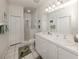 Bathroom featuring a double sink vanity and walk-in shower at 595 Back Nine Dr, Venice, FL 34285