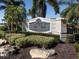 Elegant entrance sign to the community with lush landscaping at 595 Back Nine Dr, Venice, FL 34285