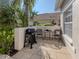 Paver patio with a grill and outdoor seating at 595 Back Nine Dr, Venice, FL 34285