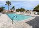 Inviting swimming pool with lounge chairs in a peaceful residential community at 595 Back Nine Dr, Venice, FL 34285