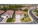 Aerial view of a house with a brown roof and landscaping at 600 Nasturtium Ct, Nokomis, FL 34275