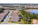 Aerial view of community with lake and houses at 600 Nasturtium Ct, Nokomis, FL 34275