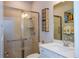 Modern bathroom with a walk-in shower and updated fixtures at 600 Nasturtium Ct, Nokomis, FL 34275