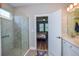 Bathroom with a large walk-in shower and adjacent bedroom access at 600 Nasturtium Ct, Nokomis, FL 34275