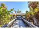 Beachfront concessions with wooden walkway at 600 Nasturtium Ct, Nokomis, FL 34275