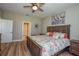 Main bedroom with a king-size bed and en-suite bathroom access at 600 Nasturtium Ct, Nokomis, FL 34275