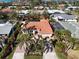 Aerial view of property shows roof, verdant landscaping, and proximity to the bay at 612 Cadiz Rd, Venice, FL 34285