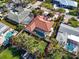 Scenic aerial view showing the property's landscaped yard, proximity to neighboring homes, and the street at 612 Cadiz Rd, Venice, FL 34285