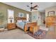 Inviting main bedroom features plantation shutters, ceiling fan, and custom furnishings at 612 Cadiz Rd, Venice, FL 34285