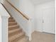 Bright foyer with tiled floor, stairway, and secure front door access at 6341 Milestone Loop, Palmetto, FL 34221