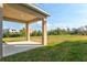 Covered patio with open view of the backyard, creating a seamless transition between indoor and outdoor living at 6341 Milestone Loop, Palmetto, FL 34221