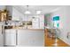 Bright kitchen with ample counter space, white cabinetry, and stainless-steel appliances at 6462 Haele Ct, North Port, FL 34287