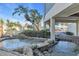 Relaxing water feature with palm trees creating a serene entrance to the building at 700 Golden Beach Blvd # 221, Venice, FL 34285