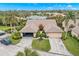 Aerial view of a single-Gathering home with two-car garages, lush landscaping, and a well-maintained yard at 7145 Lakeside Dr, Sarasota, FL 34243