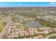 Aerial view of townhome community showcasing scenic lakes and lush landscaping at 7145 Lakeside Dr, Sarasota, FL 34243