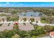 Aerial view of townhomes, showcasing the property's location near a scenic lake at 7145 Lakeside Dr, Sarasota, FL 34243