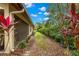 Private backyard featuring lush greenery along the back of the villa, offering a tranquil outdoor space at 7145 Lakeside Dr, Sarasota, FL 34243