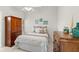 Cozy bedroom with nautical décor, soft lighting and beachy vibe at 7145 Lakeside Dr, Sarasota, FL 34243