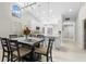 Dining room adjacent to open kitchen with stainless steel appliances and bright and airy feel at 7145 Lakeside Dr, Sarasota, FL 34243