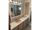 Well-lit bathroom with plenty of counter space and cabinets at 718 Roma Rd, Venice, FL 34285