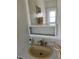 Compact bathroom sink area with mirror and basic fixtures at 718 Roma Rd, Venice, FL 34285