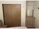 Bedroom with a closet and dresser at 718 Roma Rd, Venice, FL 34285