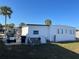 View of the rear exterior with an outdoor patio at 718 Roma Rd, Venice, FL 34285