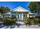 Exterior view of the inviting community clubhouse showcasing well-maintained landscaping and a welcoming entrance at 734 Brightside Crescent Dr # 18, Venice, FL 34293