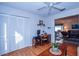 Bright home office featuring wood floors, a large closet, and an office desk at 734 Brightside Crescent Dr # 18, Venice, FL 34293