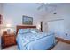 Comfortable bedroom with neutral walls, wood floors, and a large closet at 734 Brightside Crescent Dr # 18, Venice, FL 34293