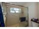 Shower with grab bar, window, and a partial glass door at 734 Brightside Crescent Dr # 18, Venice, FL 34293