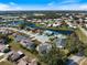 Expansive aerial view of a lakefront community showcasing the home's prime location and surroundings at 734 Sugarwood Way, Venice, FL 34292