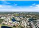 Aerial view of the community showcasing picturesque lakes, lush greenery, and well-maintained homes at 734 Sugarwood Way, Venice, FL 34292