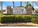 Entrance sign to the Chestnut Creek deed restricted community surrounded by manicured landscaping at 734 Sugarwood Way, Venice, FL 34292