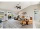 Comfortable living room with vaulted ceiling and outdoor views at 734 Sugarwood Way, Venice, FL 34292