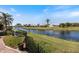 Scenic waterfront view from the property showcasing lush landscaping and peaceful waters at 734 Sugarwood Way, Venice, FL 34292