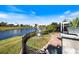 Backyard with a view of the water and manicured landscaping, providing a serene outdoor space at 734 Sugarwood Way, Venice, FL 34292