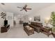 Inviting living room features a ceiling fan, and an adjacent dining area at 748 White Pine Tree Rd # 208, Venice, FL 34285