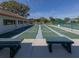 Community shuffleboard courts with benches for relaxing at 748 White Pine Tree Rd # 208, Venice, FL 34285