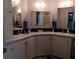 Bathroom featuring a white vanity with double sinks and ample lighting at 749 N Green Cir, Venice, FL 34285