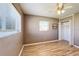 Cozy bedroom features wood-look floors, closet space, and a window for natural light at 7903 Hyde Park Ave, North Port, FL 34287