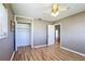 Cozy bedroom features wood-look floors, closet space, and a window for natural light at 7903 Hyde Park Ave, North Port, FL 34287