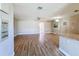 Spacious living room featuring hardwood floors and modern lighting at 7903 Hyde Park Ave, North Port, FL 34287