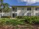 Backyard patio with views of beautiful lawn and landscaping at 805 Montrose Dr # 203, Venice, FL 34293