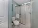 Bathroom with a toilet and a shower with sliding doors at 805 Montrose Dr # 203, Venice, FL 34293