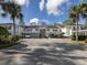 Spacious condo building with ample parking, lush landscaping, and a welcoming neighborhood atmosphere at 805 Montrose Dr # 203, Venice, FL 34293