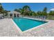 Beautiful community pool with clear blue water, brick pavers, and plenty of seating for residents to enjoy at 805 Montrose Dr # 203, Venice, FL 34293